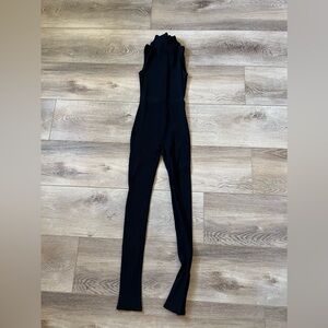Ribbed jumpsuit. I don’t remember the size but fits like a small